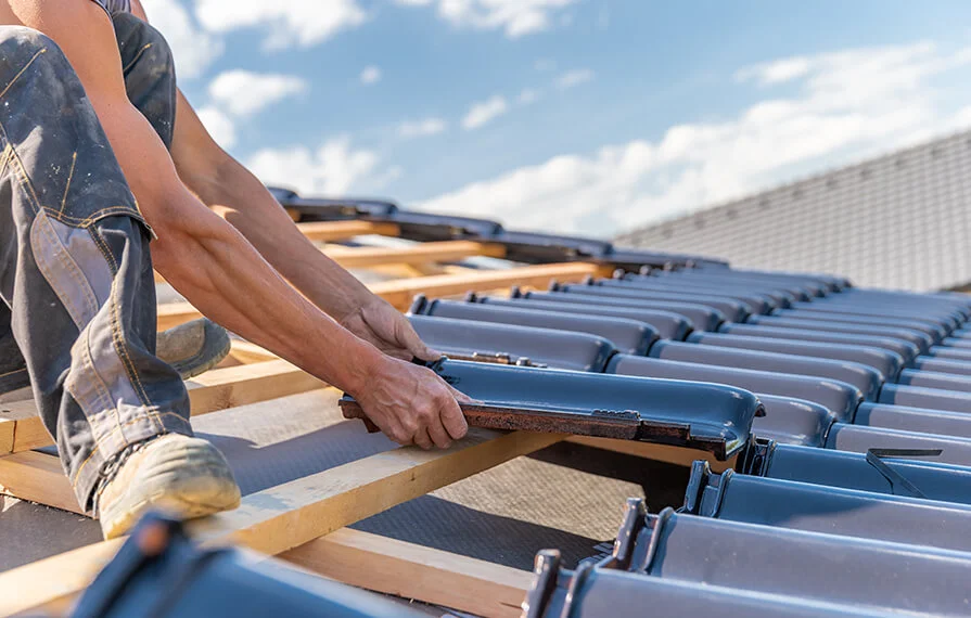 Building worker help each other with at construction site